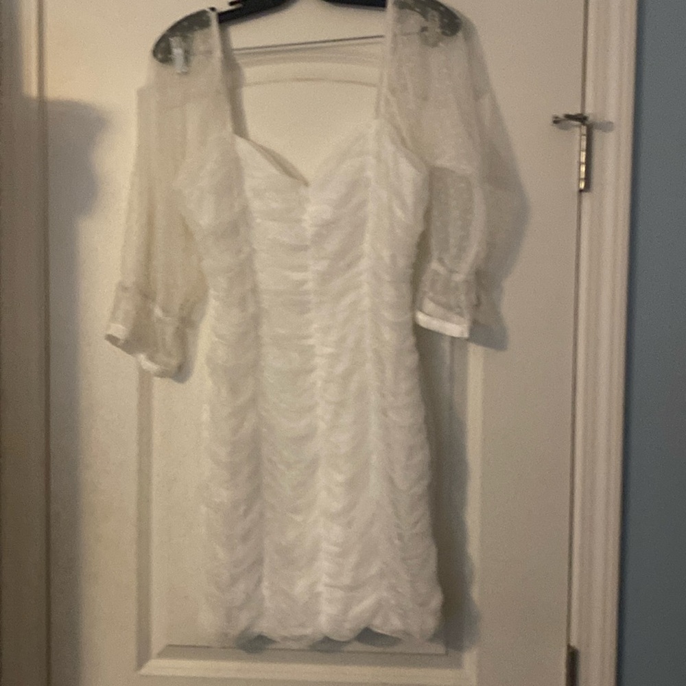 White three-quarter length dress  lace sleeves fitted bodice
